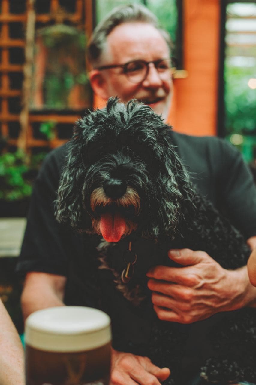 The Woodbine owner with a dog inside the pub